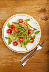 italian vegetable salad with boiled potato, cherry tomatoes, gre