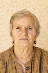 Closeup portrait, elderly lady looking at camera