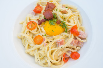 Close-Up Spaghetti Carbonara On White Dish