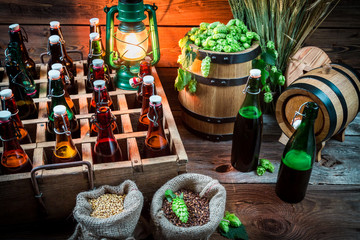Ingredients for beer and bottles in the cellar