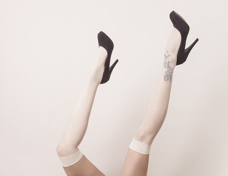 Female Legs Up In The Air Wearing Parisian Stockings