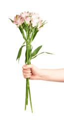 Hand holding bouquet of alstroemerias