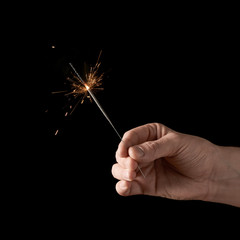 Holding a burning sparkler