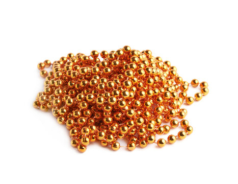 Pile of golden beads on a string