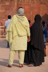 Indian women standing at Qutub Minar, Delhi, India