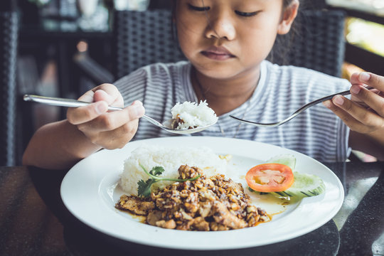 Thai Children Eating In Restaurant