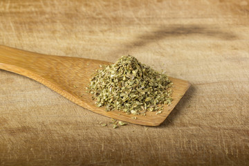 Oregano in a wooden spoon