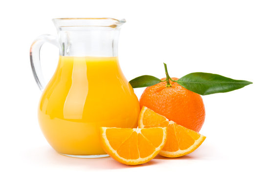 Orange fruit and jug of juice
