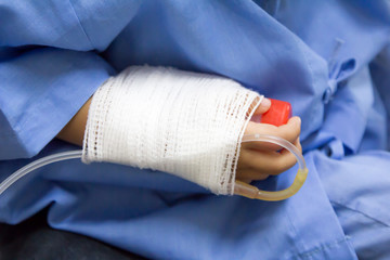 hand of sick little girl in hospital
