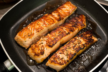 Fresh salmon filles  grilled in a pan