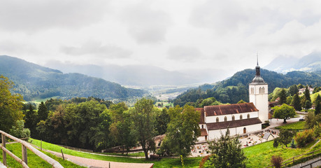 Fototapeta premium Panoramic view of Gruyeres and church. Switzerland