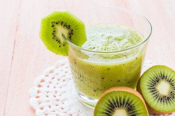 Naklejka na ściany i meble Healthy diet fruit juice kiwi wooden table