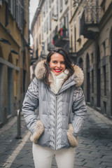 Beautiful young brunette posing in the city streets