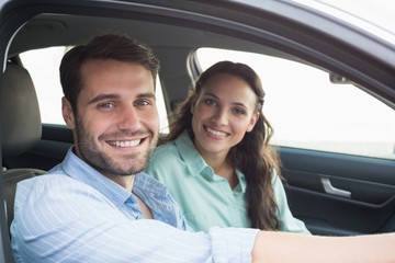 Young couple smiling at the camera