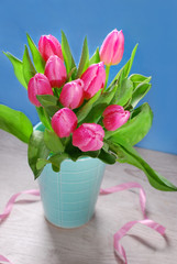 bunch of fresh pink tulips in vase