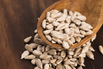 Sunflower seed with a wooden spoon