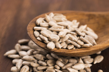 Sunflower seed with a wooden spoon