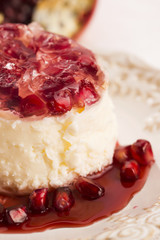 coconut panna cotta dessert with pomegranate