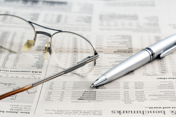 Business newspaper and glasses