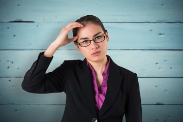 Composite image of businesswoman thinking