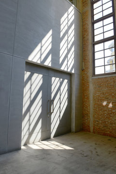 Sunlight from window on the cement walls and floor