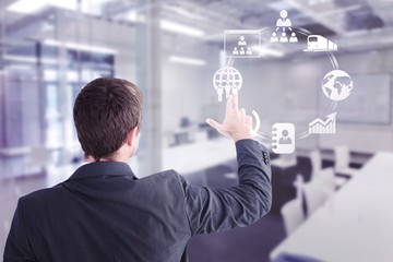 Composite image of businessman pointing with his fingers