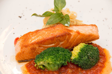 Stake from a salmon with vegetables
