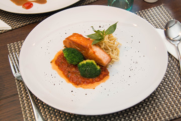 Stake from a salmon with vegetables
