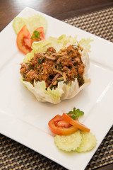 Thai spicy Tuna  salad on white plate