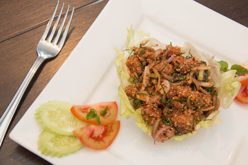 Thai spicy Tuna  salad on white plate