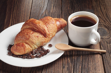 Croissant and coffee cup