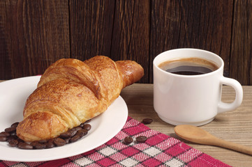Breakfast with croissant and coffee