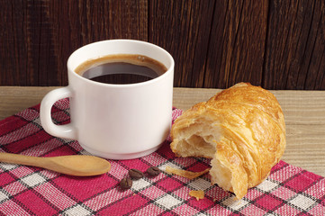 Breakfast with coffee and croissant