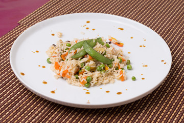 Risotto decorated with green pea.