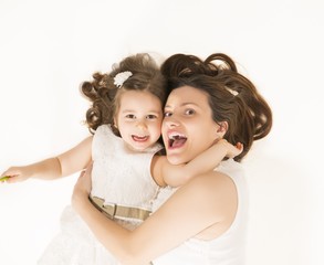 Mother and daughter having fun playing
