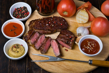 Beef Steaks with Sauces, French Fries and Vegetables