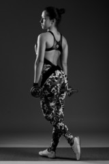 female with dumbbells