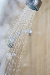 Photograph of a shower drops and streams of water