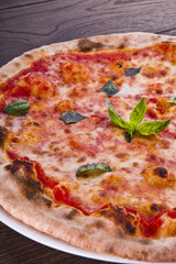 Delicious italian pizzas served on wooden table