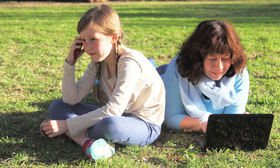 Portrait mother and daughter outdoors