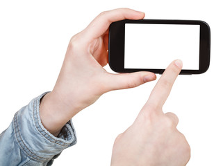 hand in shirt touching smartphone isolated