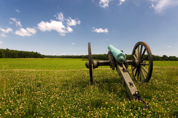 Civil War cannon in green field