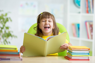 Happy child with opened book