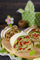 Rolls of bread with vegetables, cheese and sausage