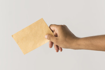 Male hand holding blank envelope. - 78379170