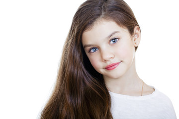 Fototapeta premium Portrait of a charming little girl smiling at camera