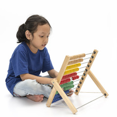 Cute little girl learning abacus isolated with white background