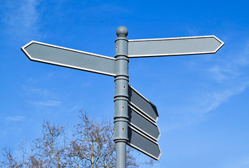 Path indicator arrow signs on the pole