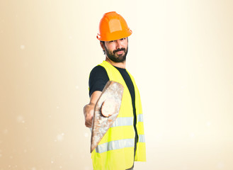 Workman with ax over white background