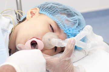 Naklejka premium Child patient receiving artificial ventilation